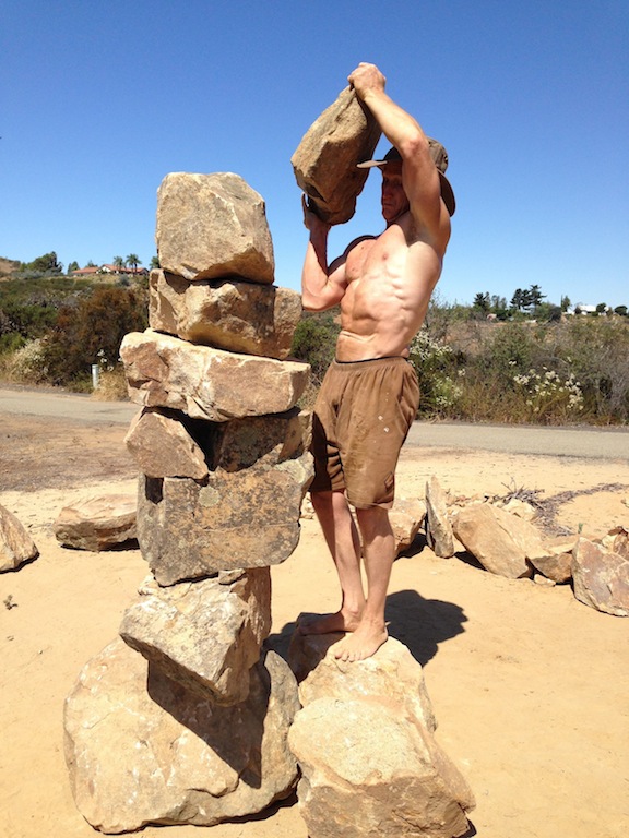 Paul building a rock stack